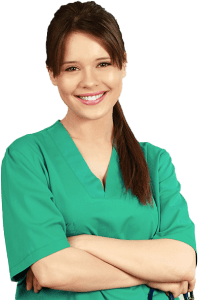 Smiling nurse in green scrubs with arms crossed.